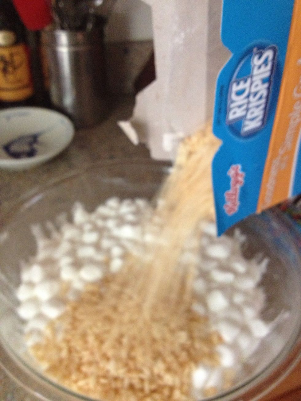 Add in about 3/4 of the box of Rice Krispies.