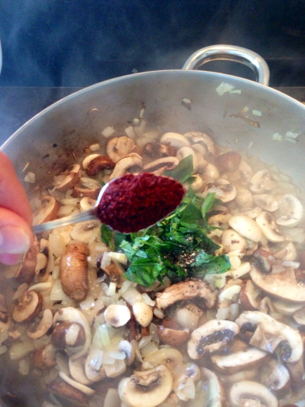 Add in basil, garlic, paprika, salt & pepper