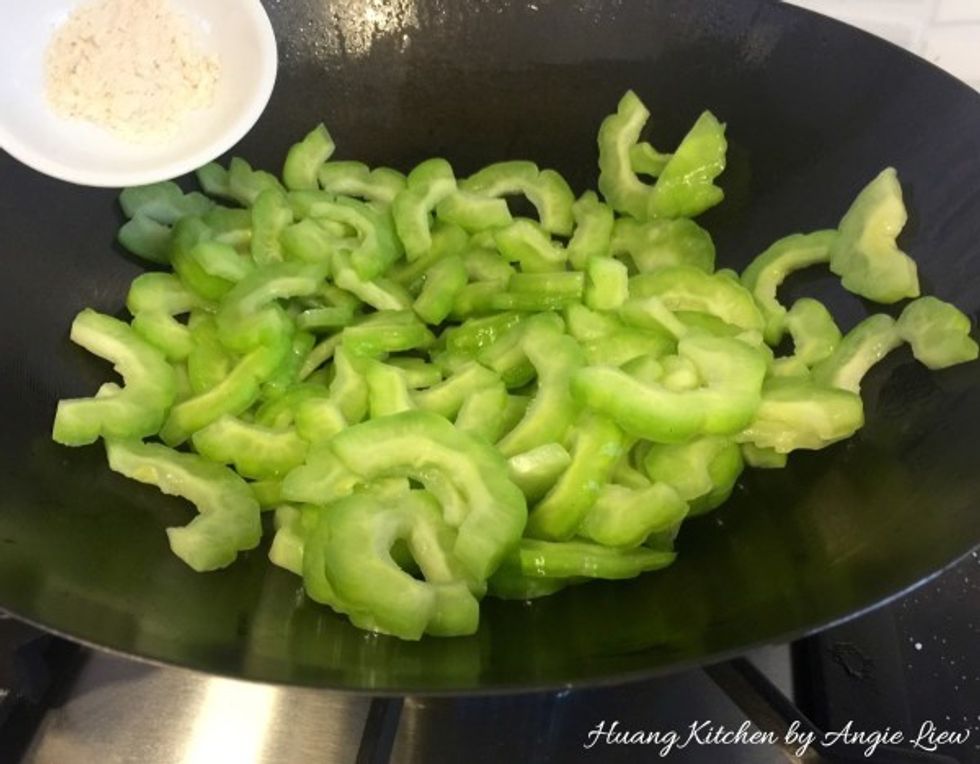 Add in bitter gourd and chicken stock granules.