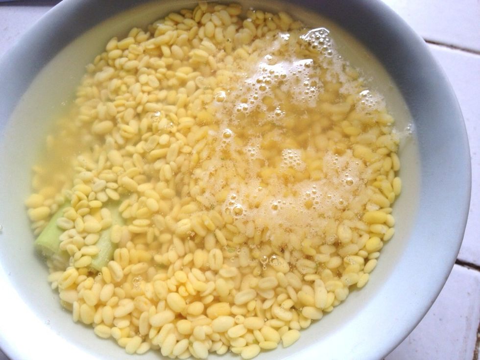 Add in boiling water (until max height is 1 cm above the mung dal's) . You can also add 1/4 tsp of salt