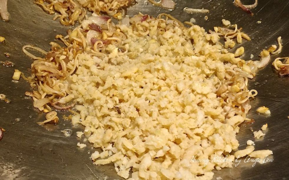 Add in dried shrimp and strips of cuttlefish. Continue to stir fry until they are really fragrant and brown. Add in more oil if needed.