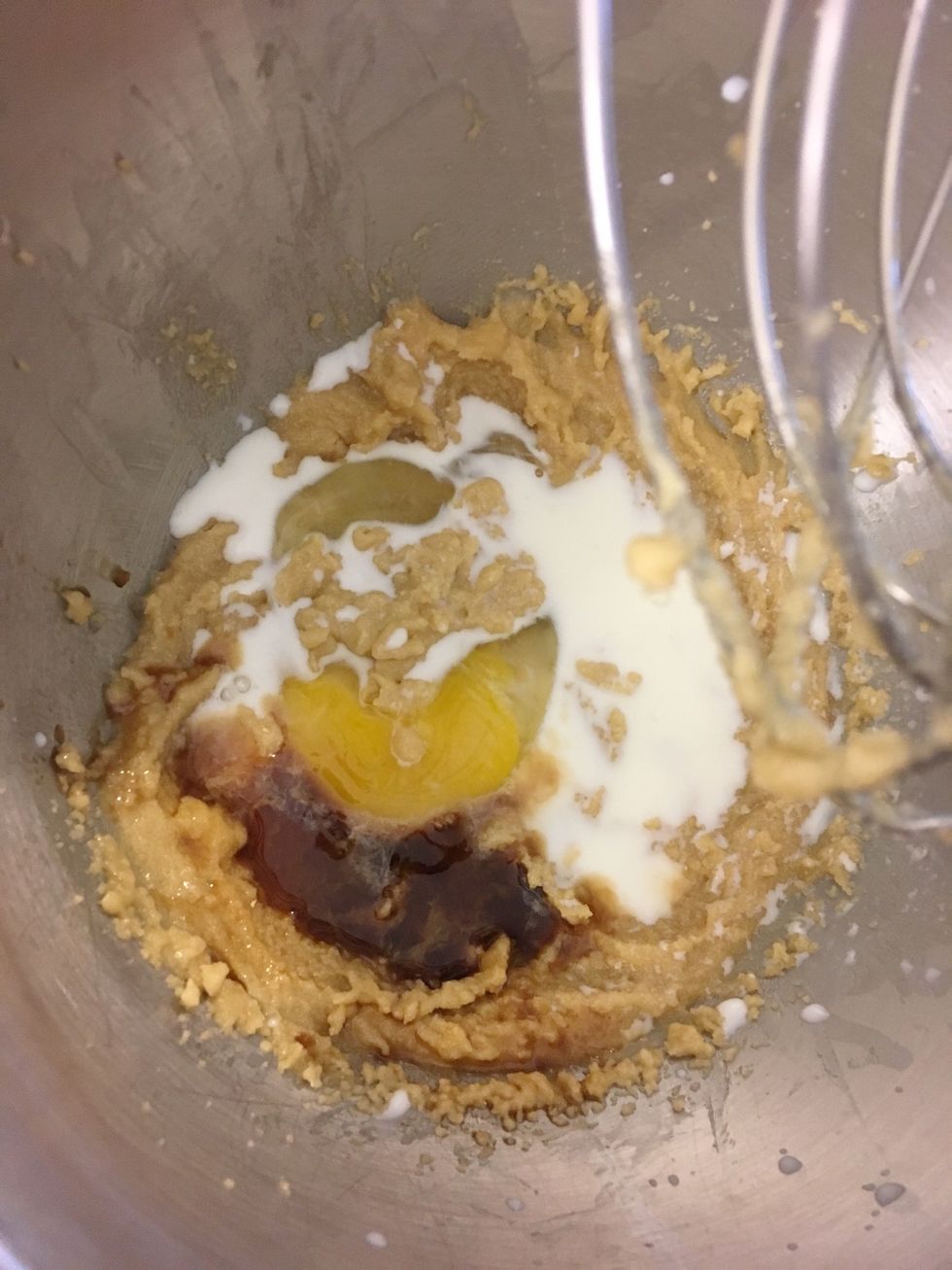 Add in egg, milk, and vanilla extract into the first mix as it is blending.