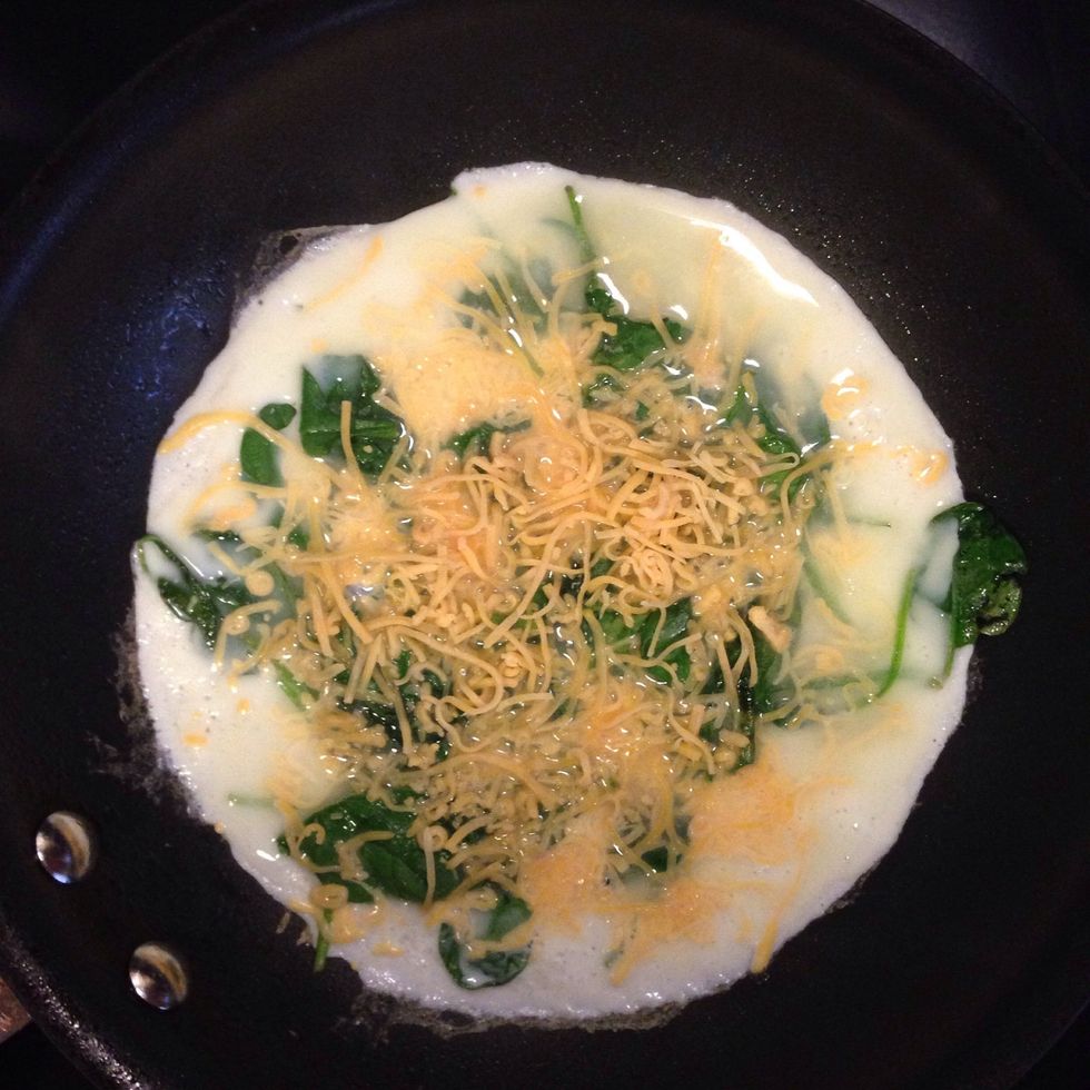 Add in egg whites and sprinkle with cheese