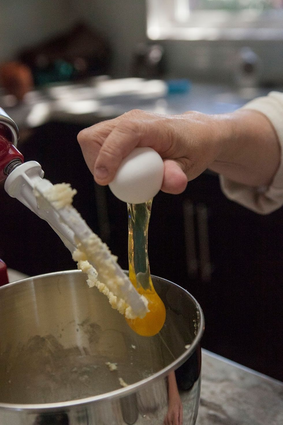 Add in eggs, one at a time. Beat them slowly and scrape down the sides of the bowl so everything is blended smoothly.