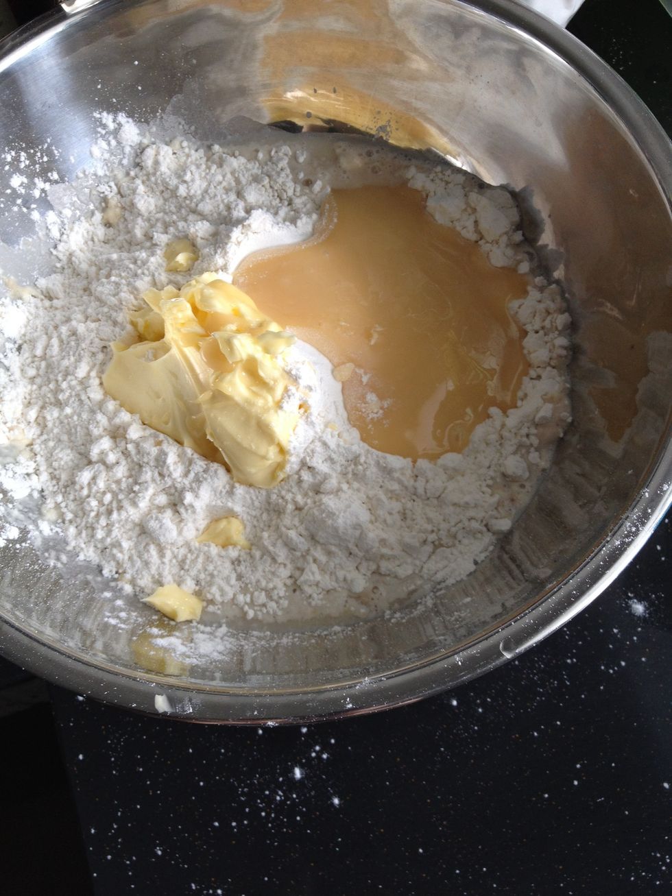Add in flour, salt, butter and condensed milk to yeast mixture.