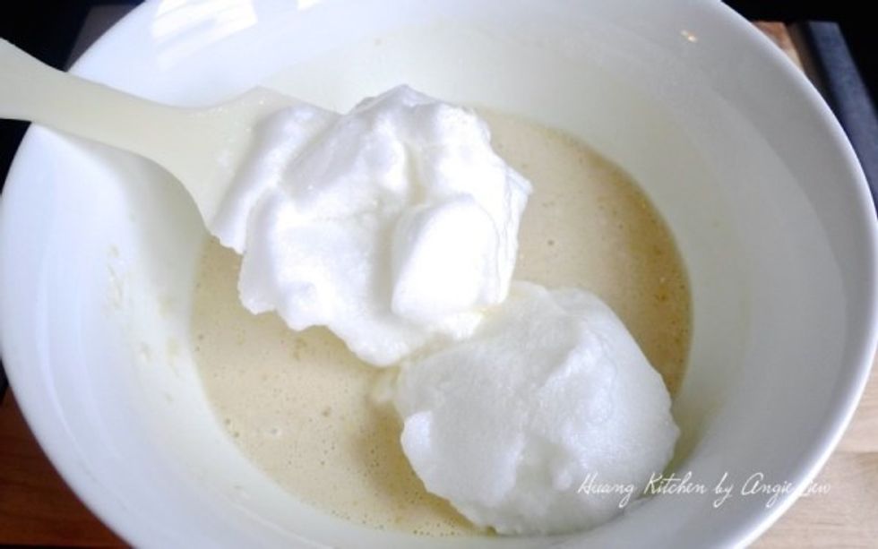 Add in half the whisked egg whites and mix well.