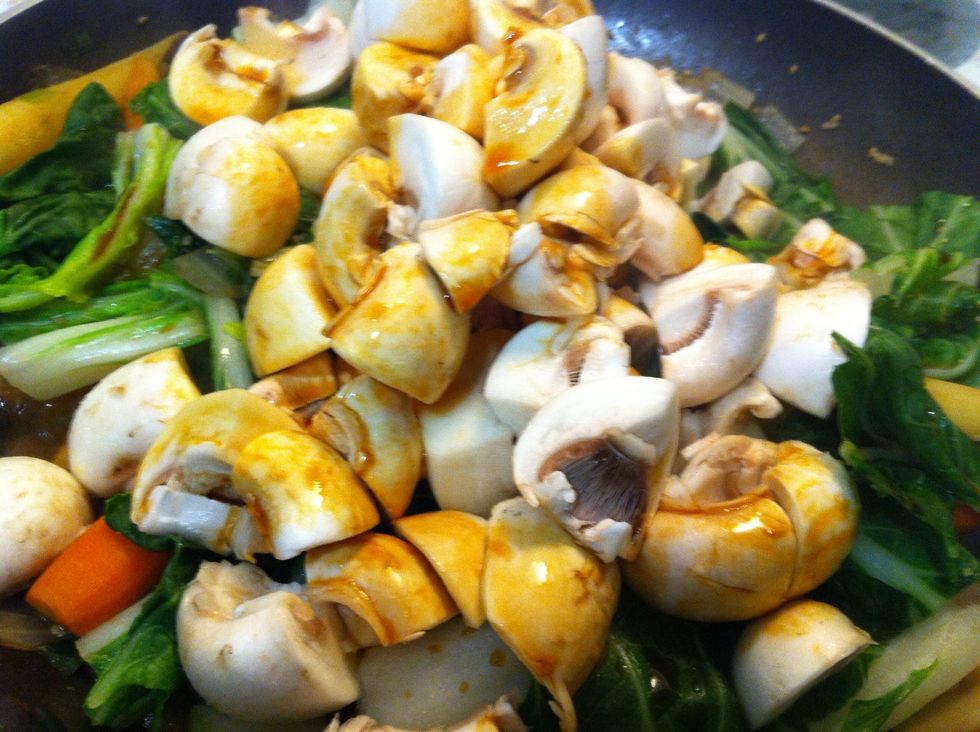 Add in mushrooms, soy sauce and additional sesame and saut\u00e9 (covered or not)