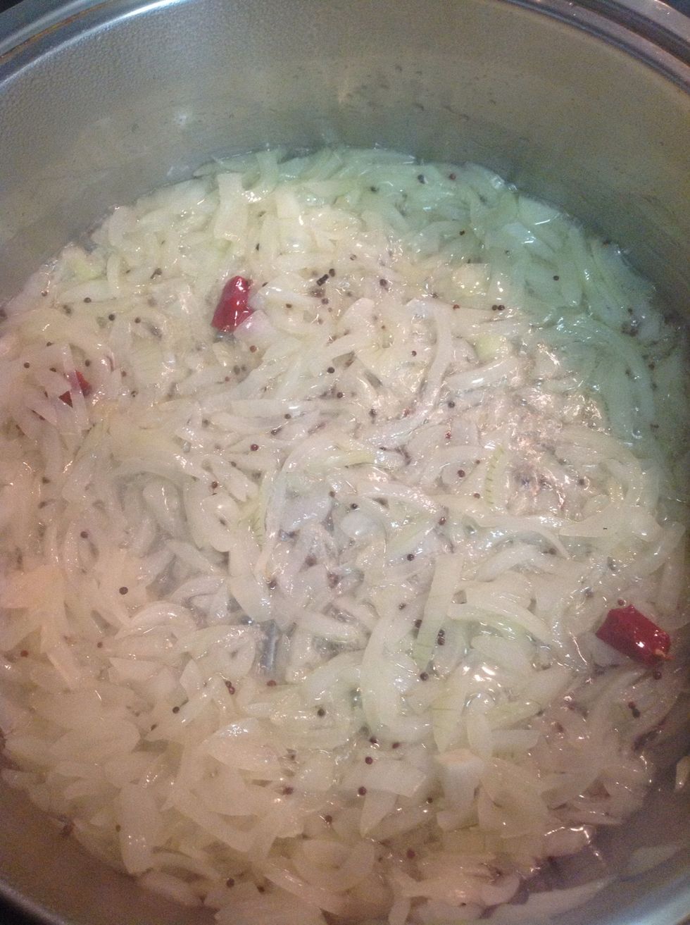Add in oil, mustard seeds and allow to cook until onions are translucent. It's important not to burn the mustard seeds as your dish will taste bitter.
