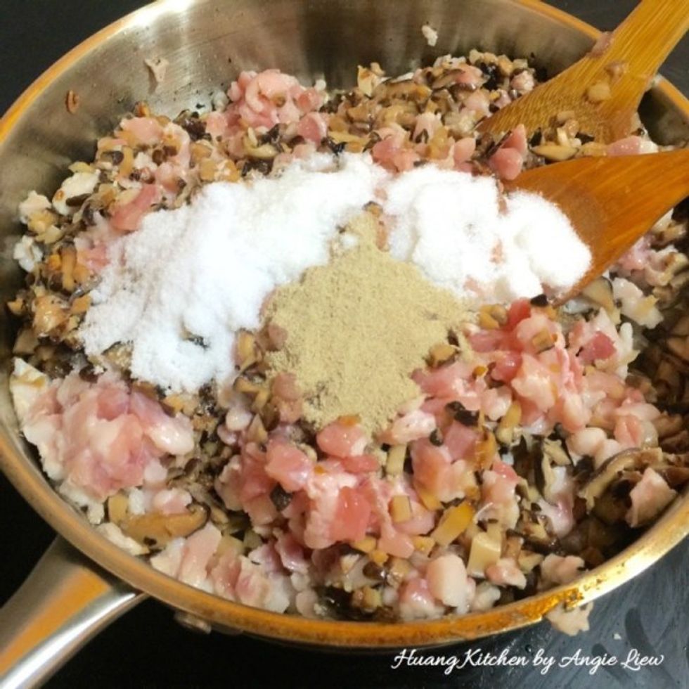 Add in pepper, salt and sugar as well. Stir fry until the pork turns opaque.