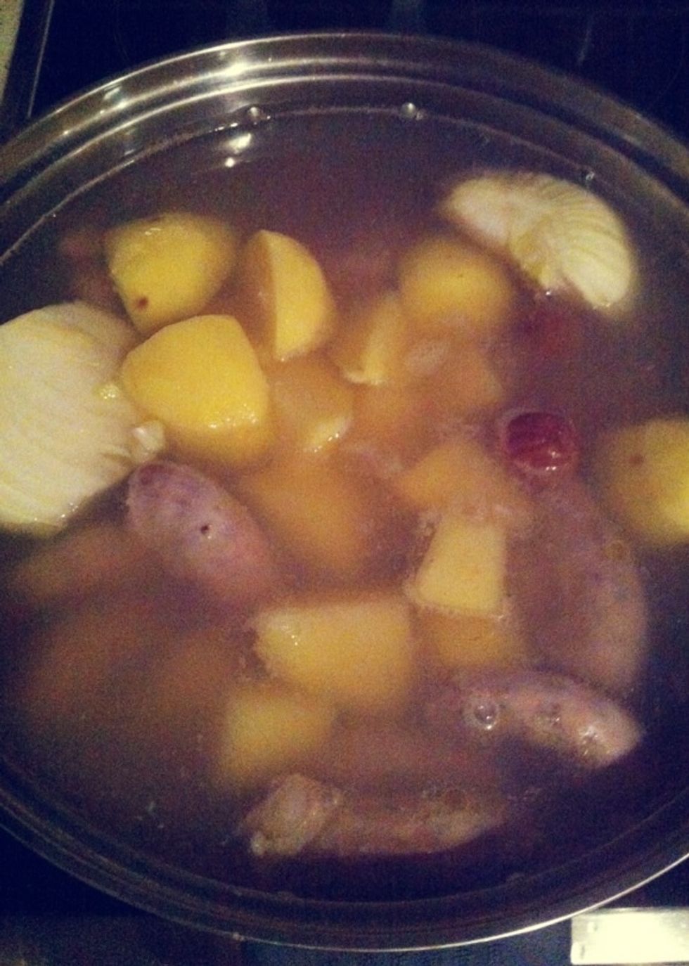 Add in potatoes, onion & salted plums, let it boils before reducing the fire to cook till everything is soft.