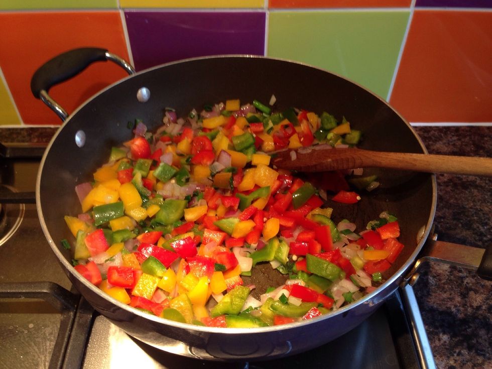 Add in some chopped peppers and continue to shallow fry until tender