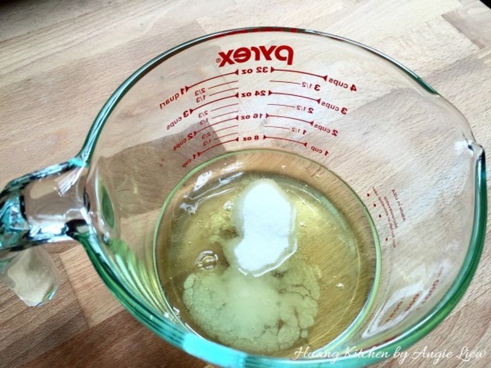 Add in sugar followed by a pinch of salt.