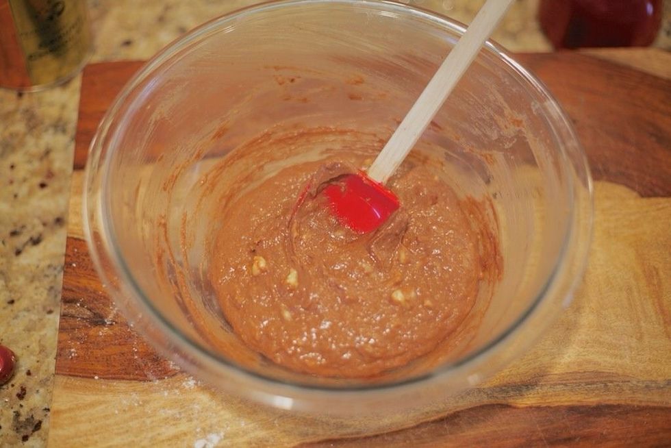 Add in the almond milk, whole wheat flour, and cocoa. Mix well.