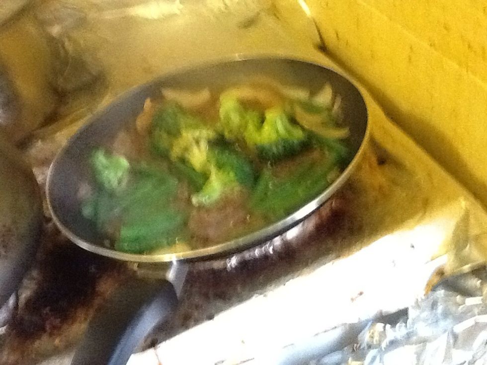 Add in the broccoli, beans and a cup of water