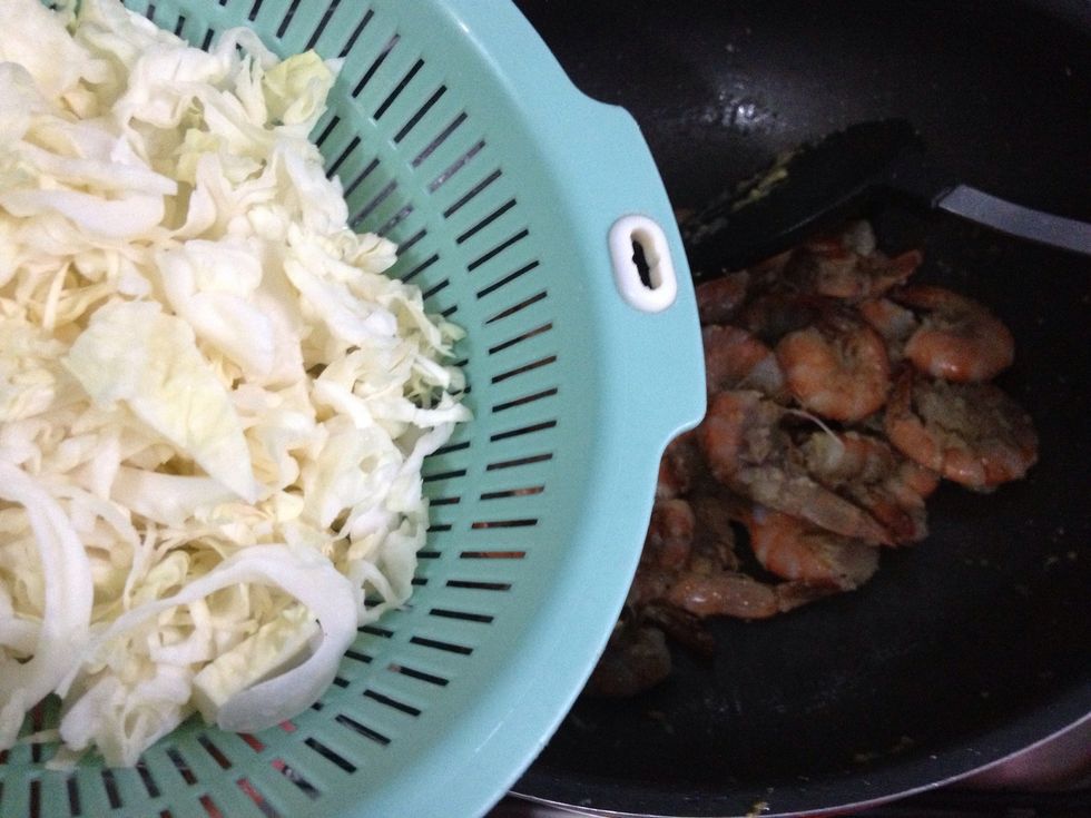 Add in the cabbage. Cook for about 1 minute