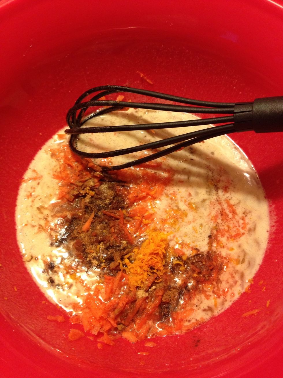 Add in the carrots, vanilla, spices, salt & orange zest