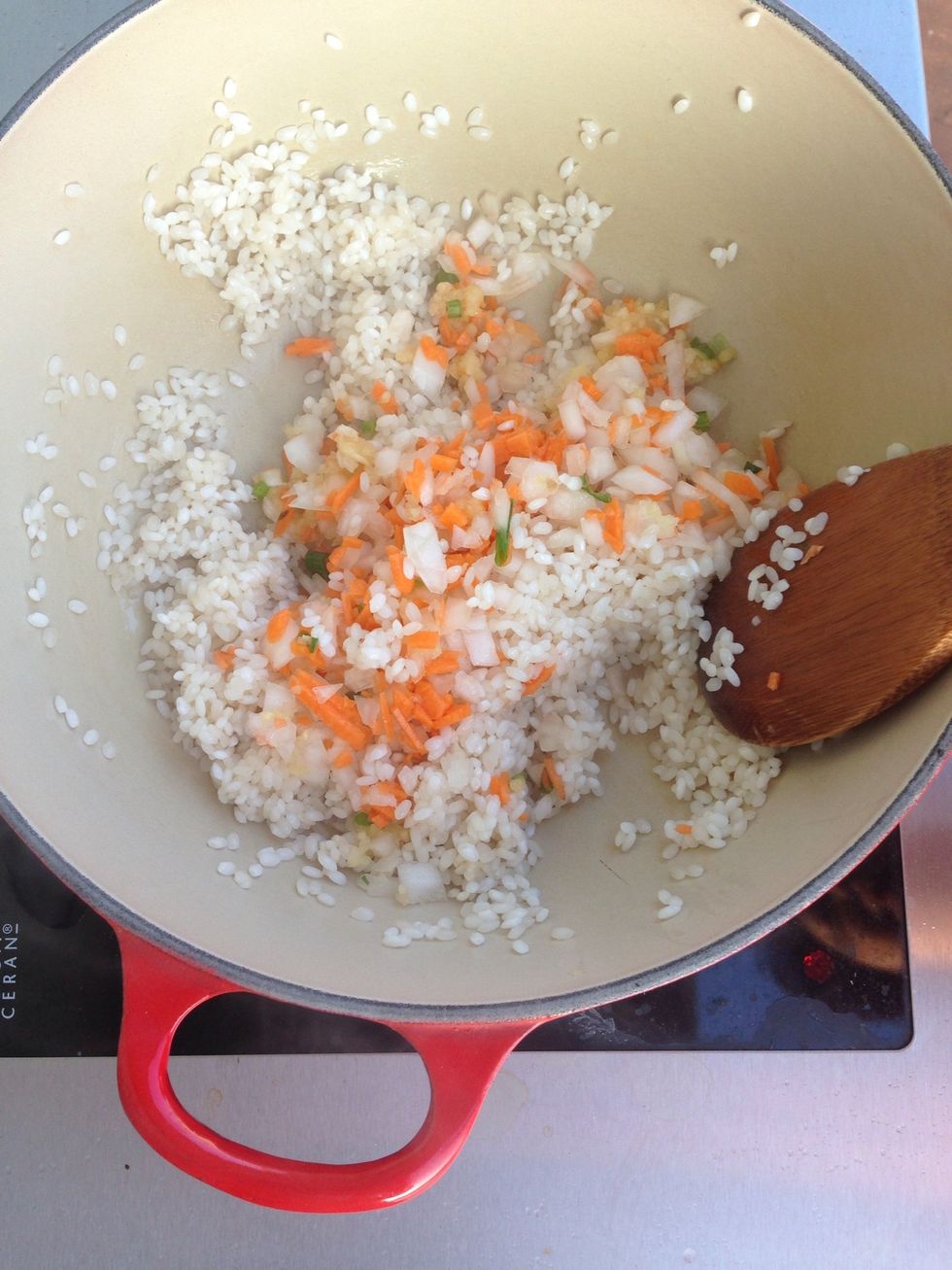 Add in the chopped carrots, onions and green sprig onions