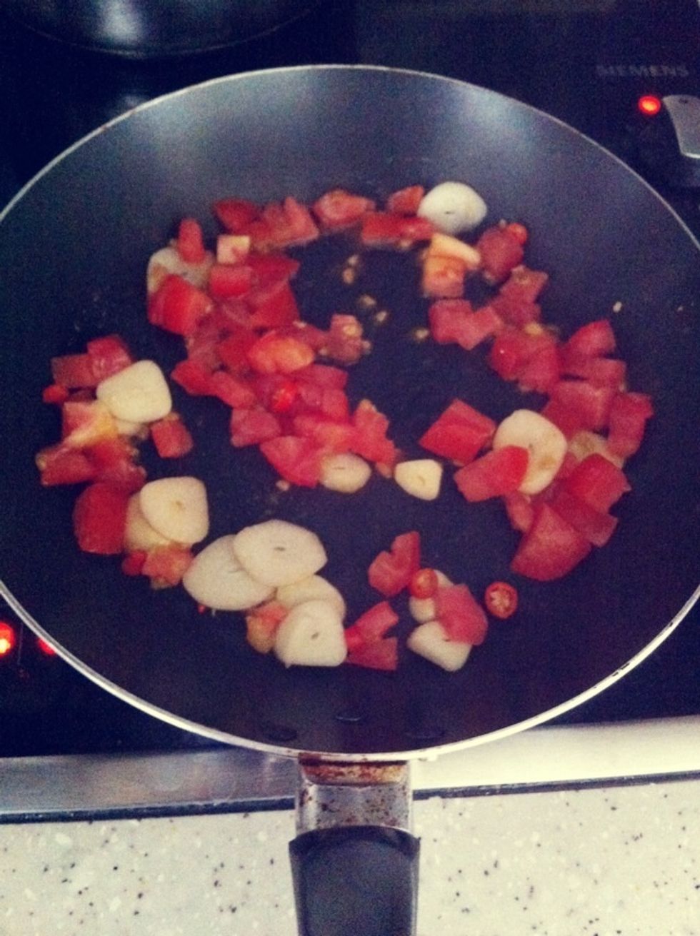 Add in the chopped tomatoes.