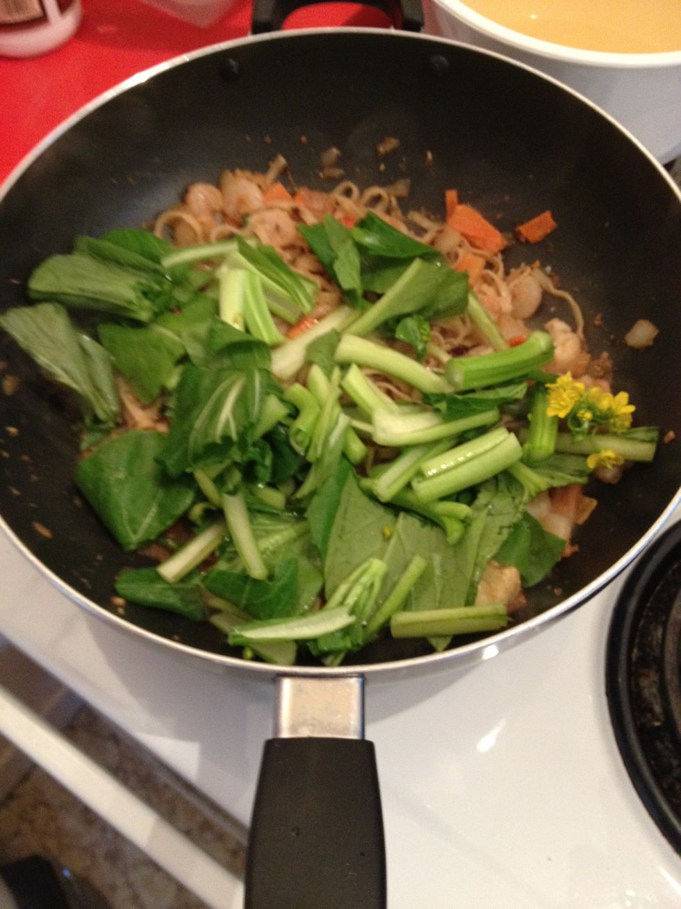 Add in the Choy sum and cook until they start to wilt slightly.