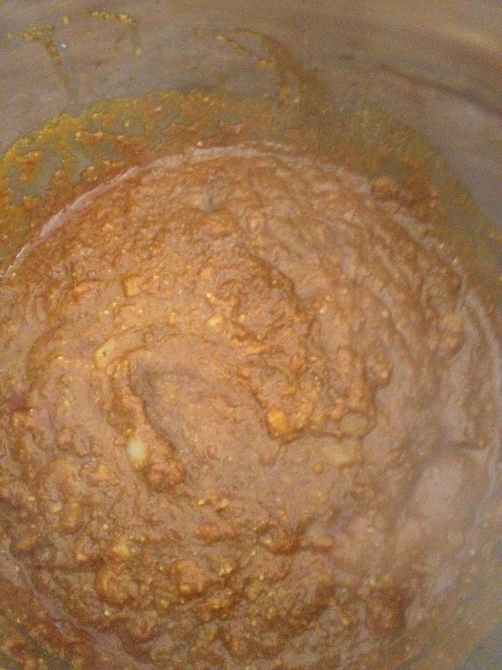 Add in the curry paste to the mixture and stir for 5 minutes in medium heat. Add the sesame oil in this step