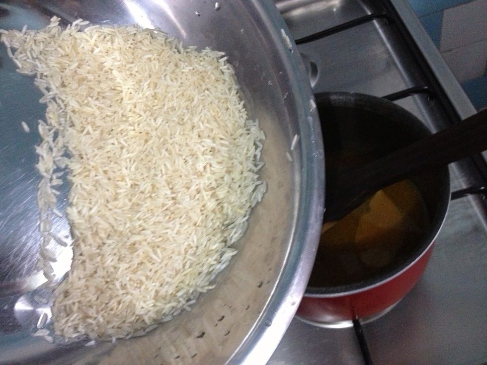 Add in the drained rice into the sauce-pan
