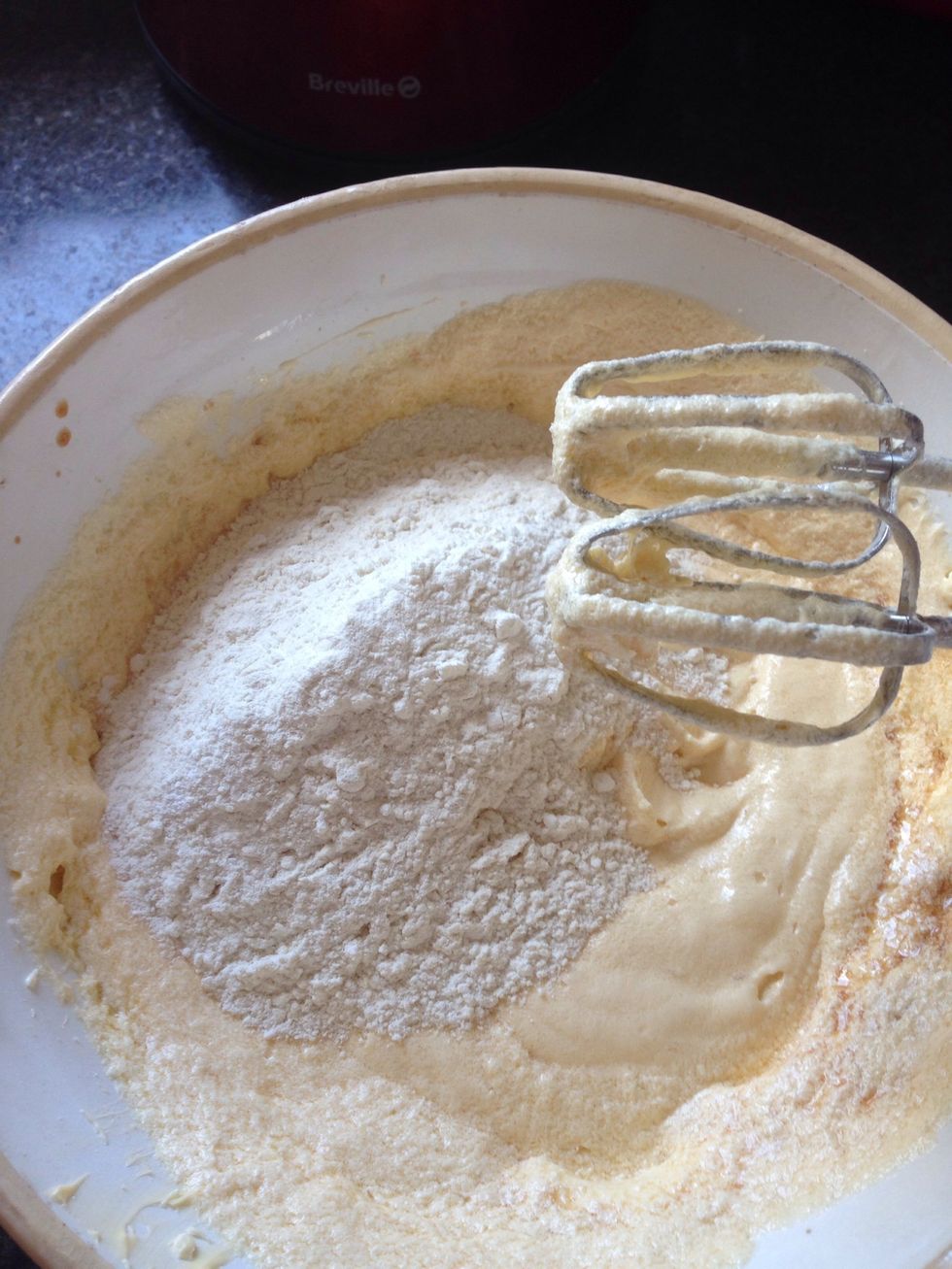 Add in the flour & baking powder in two batches, mixing until smooth