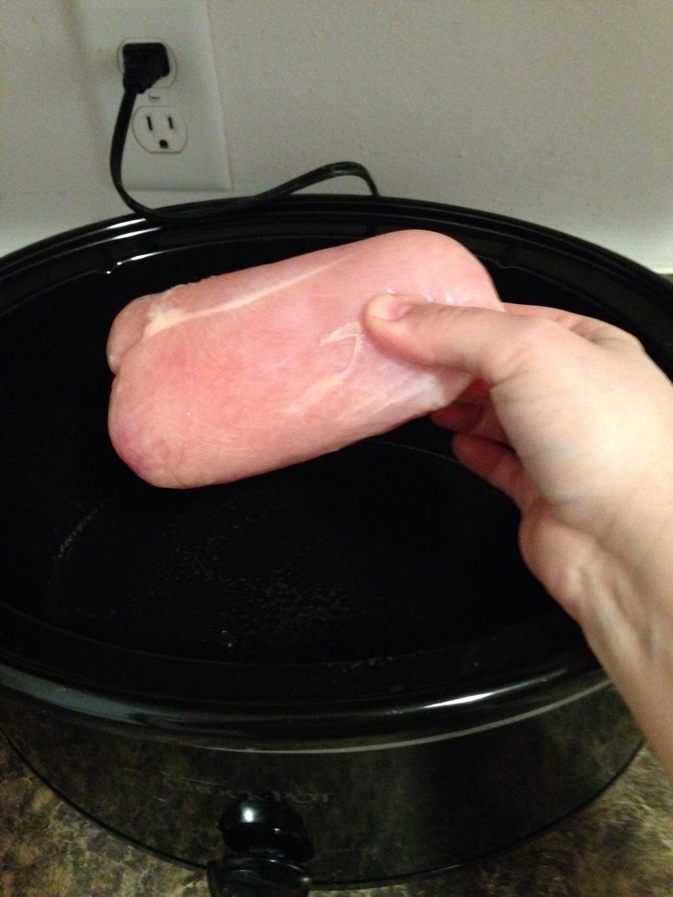 Add in the frozen chicken breasts.