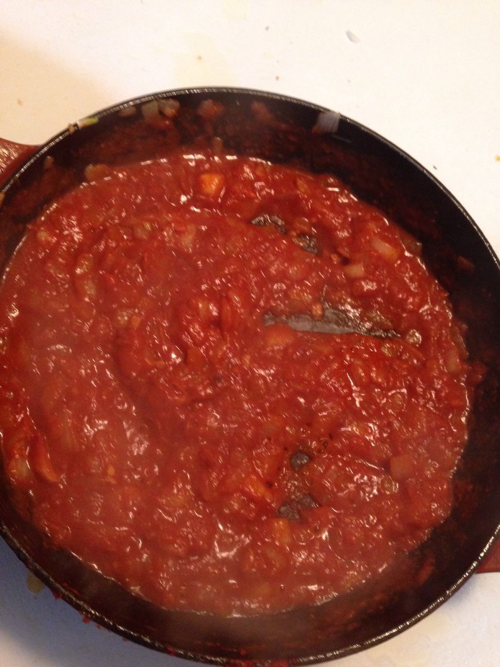 Add in the Harissa, broth and sirracha combo, stir to mix.