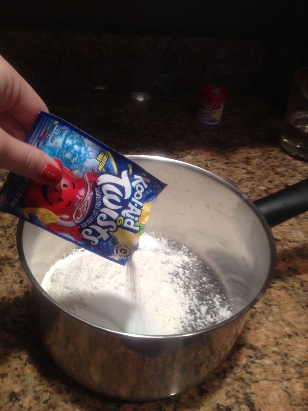 Add in the Kool-Aid mix. This smells so good!