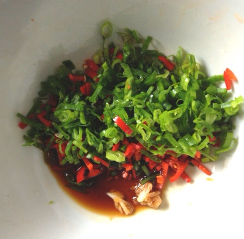 Add in the mashed garlic, sliced scallions and sliced chili. Mix it up and keep on tasting until you find the best taste on your palate