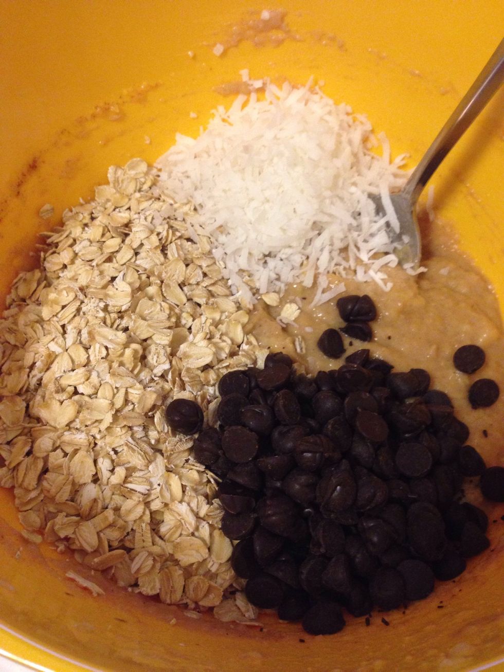 Add in the oats, chocolate chips, coconut, and optional nuts - stir until well combined.
