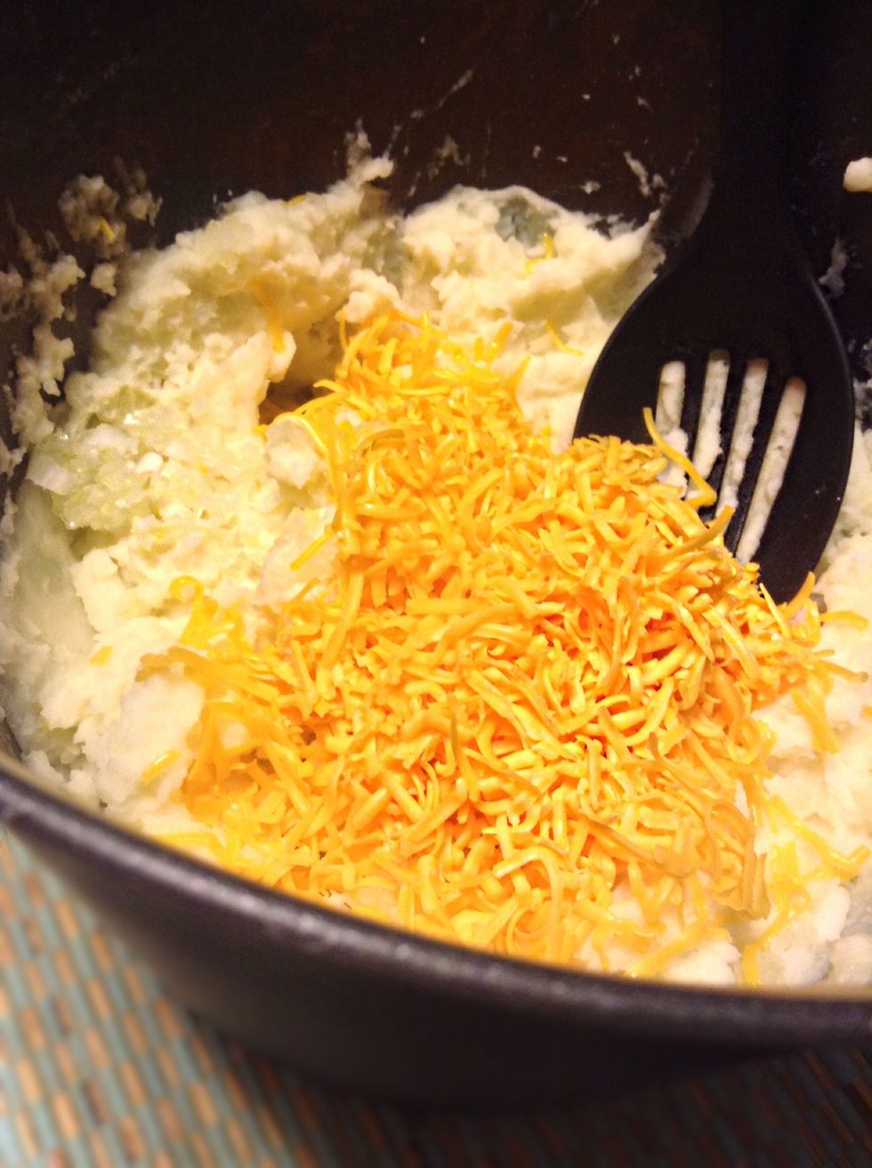Add in the one table spoon of onion and cheese. Mix well :)!!