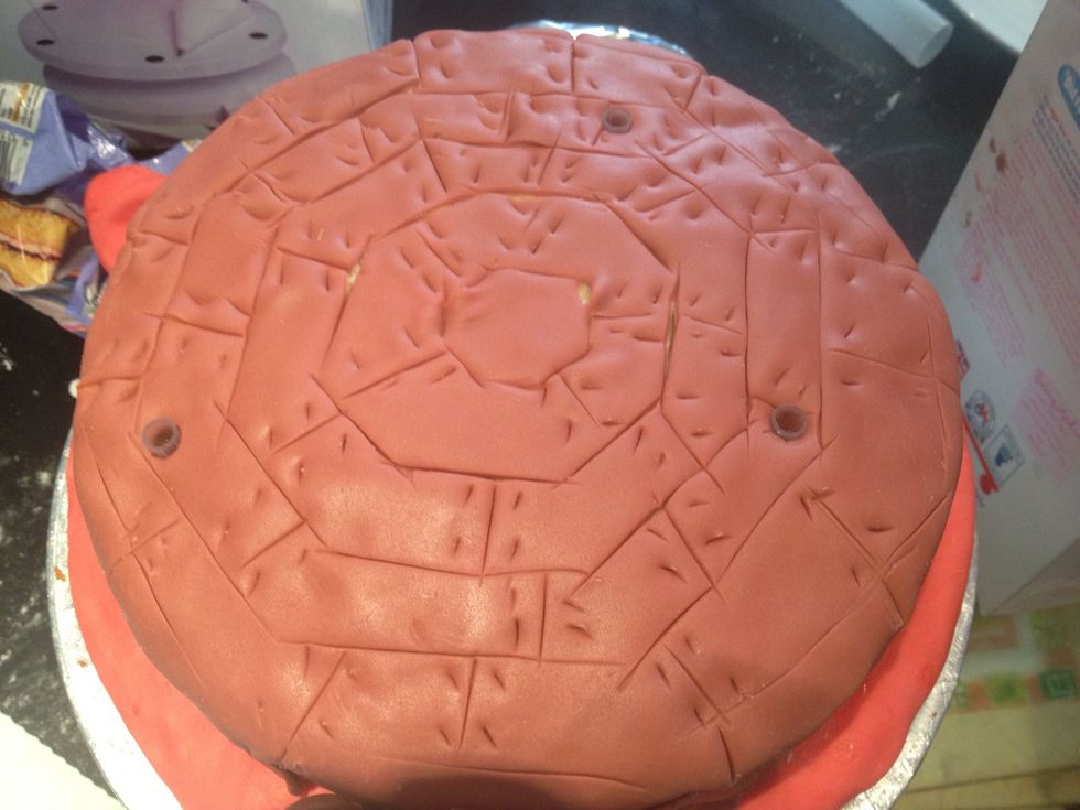 Add in the posy picks so you can put the wire for the horses in without rotting the cake