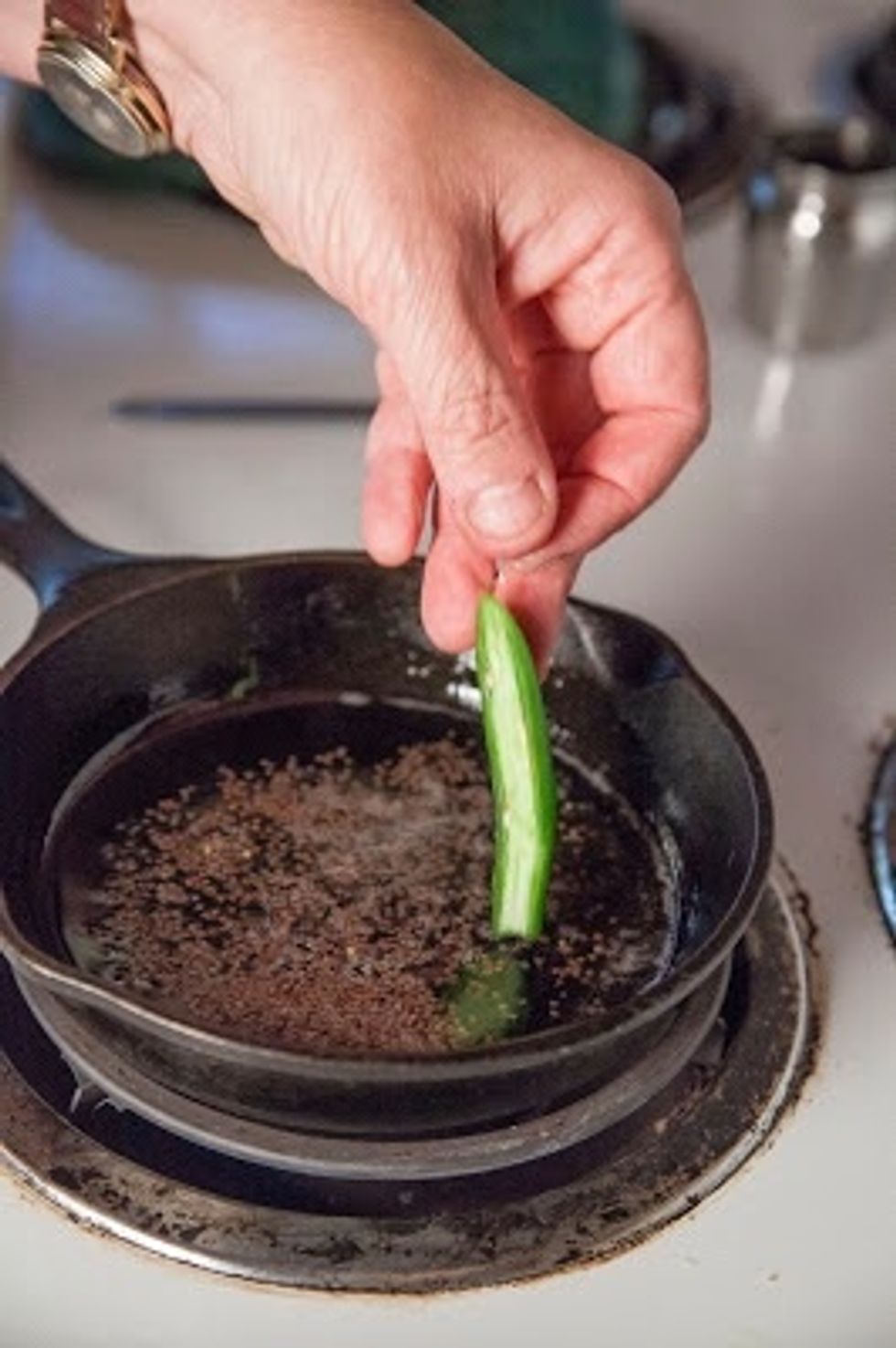 Add in the serrano chili split down the middle.