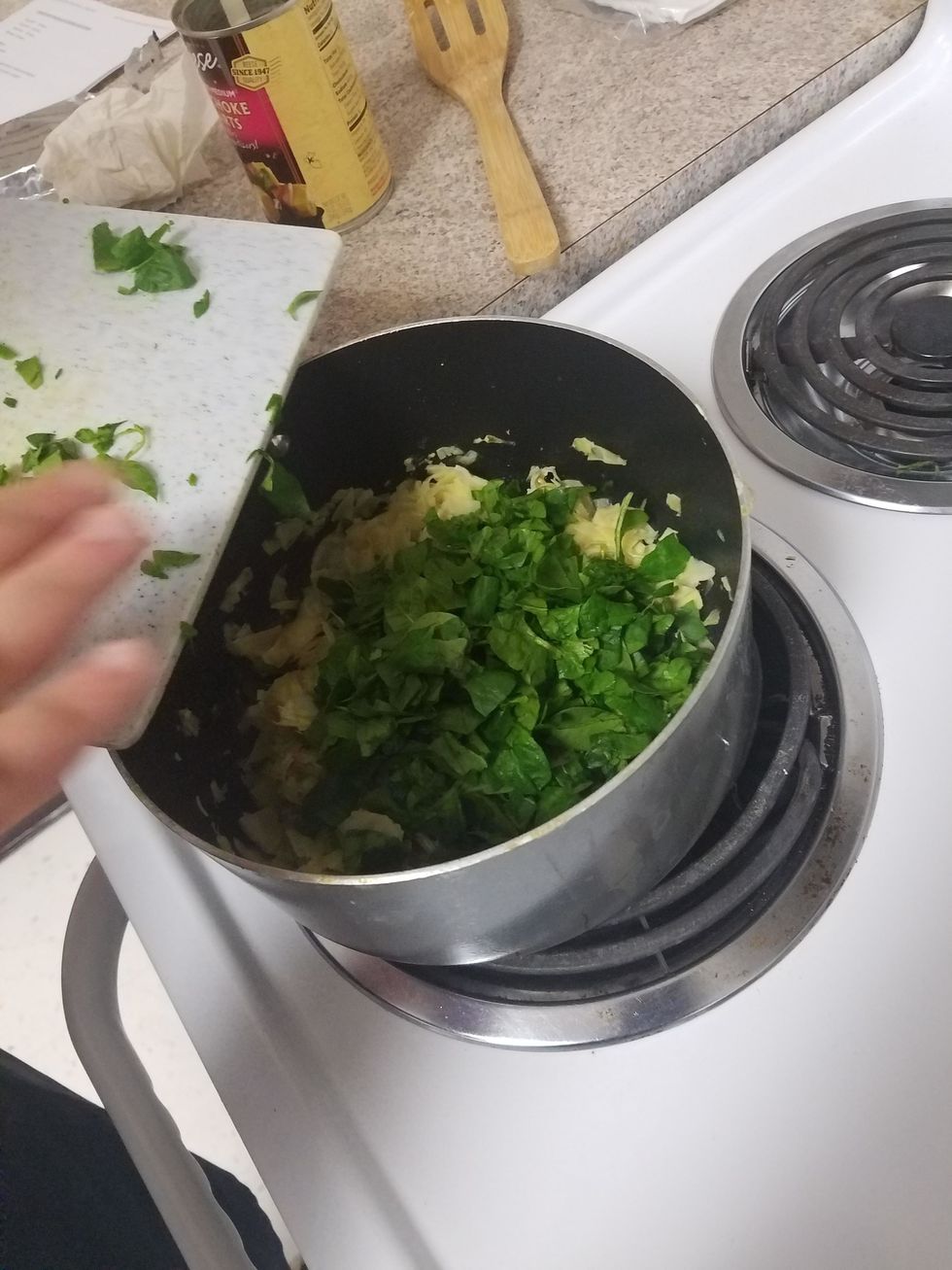 Add in the spinach, and cook until wilted, turning often.