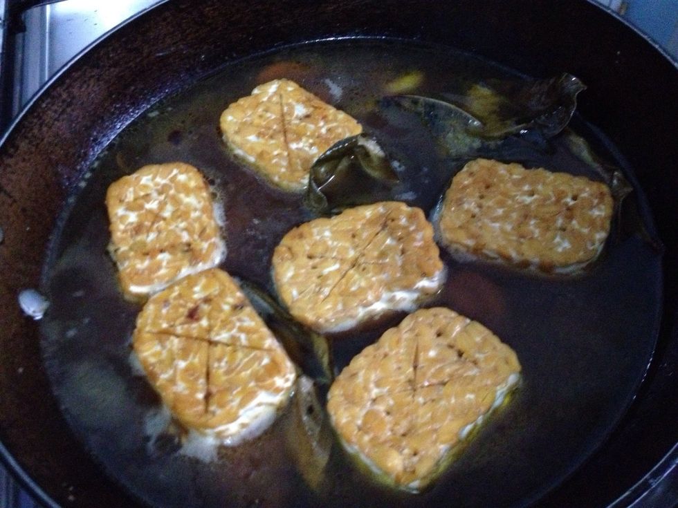 Add in the tempeh. Cover with a lid and let it simmber for 30-40 mnts. Flip on each  side every 15 mnts.