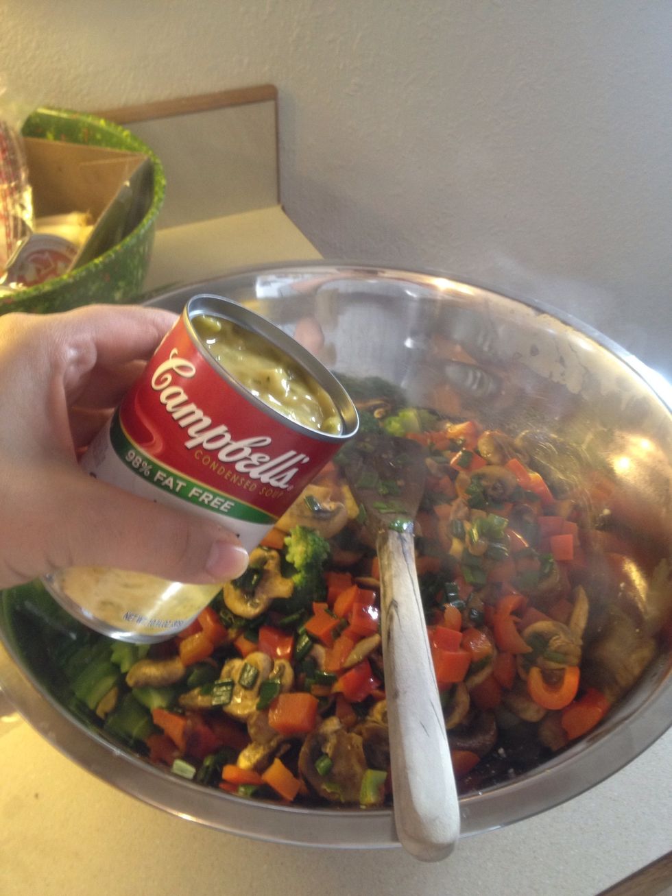 Add in the two cans of cream of chicken. I bought the wrong thing and used cheese broccoli. And it still turned out yummy. So either one doesn't matter.