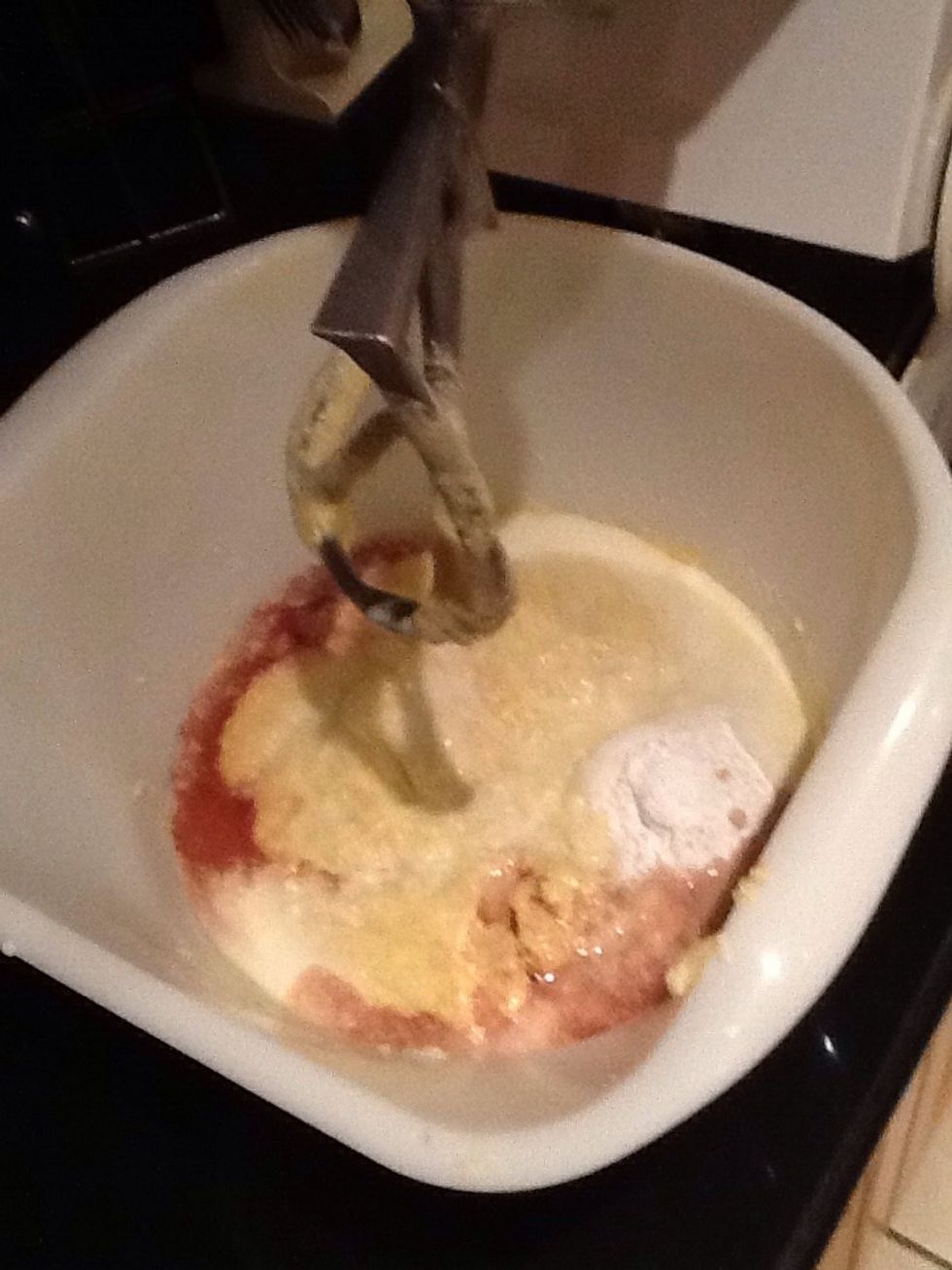 Add in the vanilla extract, baking powder and milk. Mix the ingredients together.