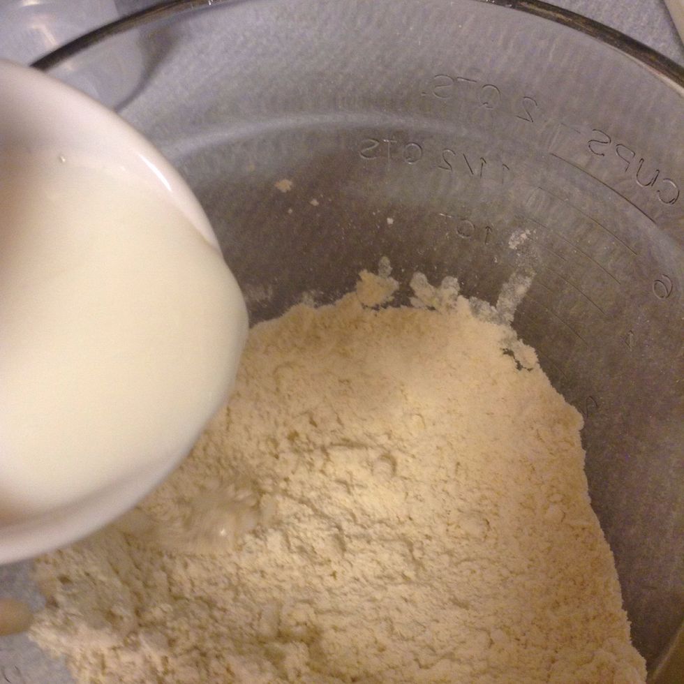 Add in warm milk. You'll need about 1/3 to 1/2 cup