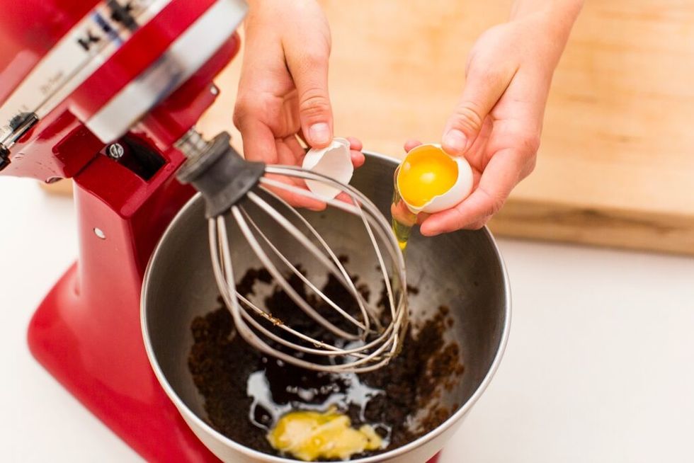 Add in your egg PLUS one extra egg yolk. The extra yolk really gives your cookie that extra chewy, soft center!