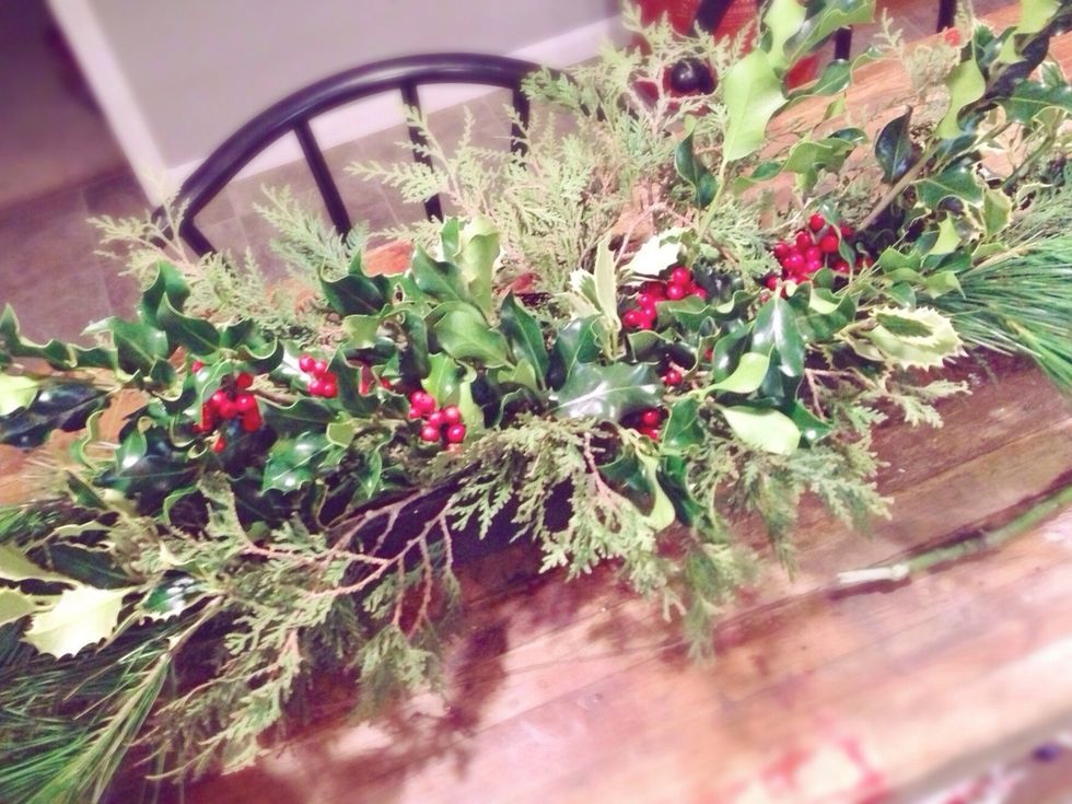Add in your holly and winter berries towards the center of the centerpiece.