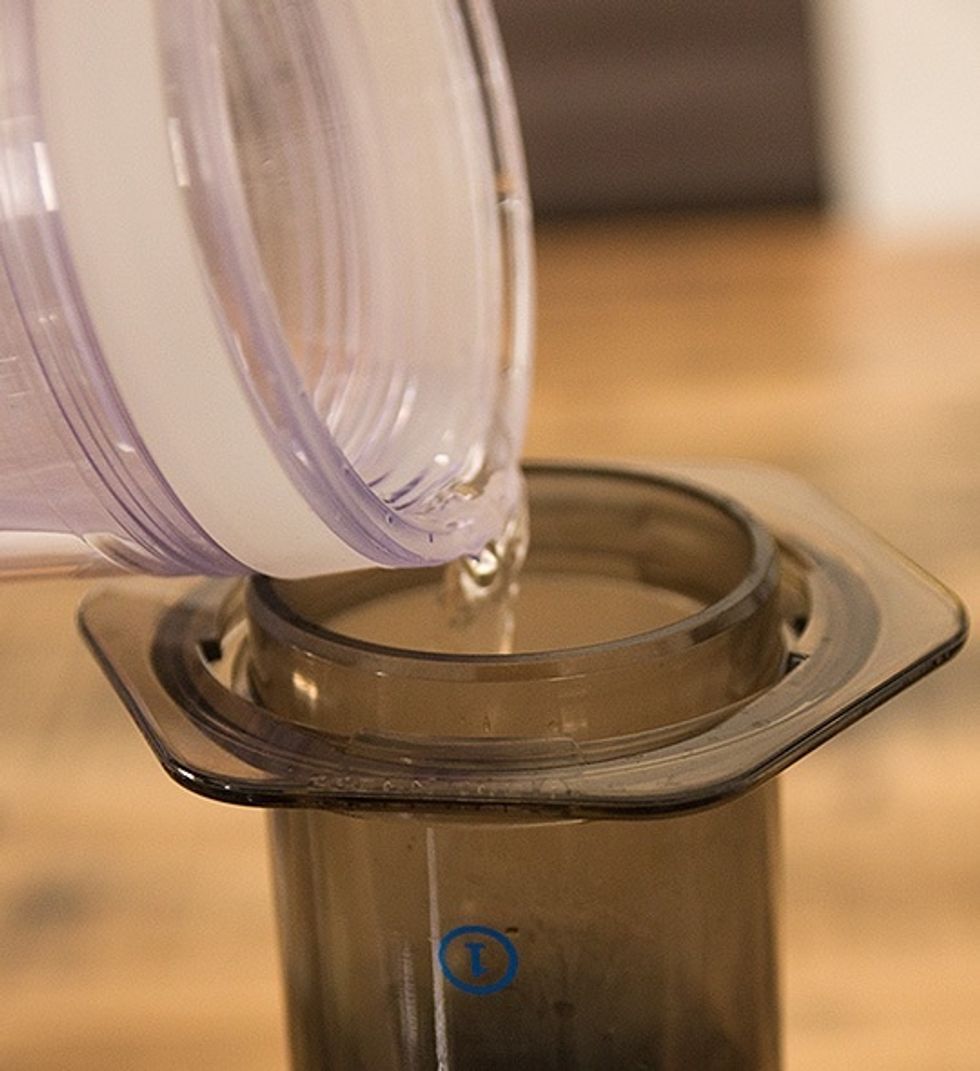Add in your hot water to your coffee in your inverted AeroPress.