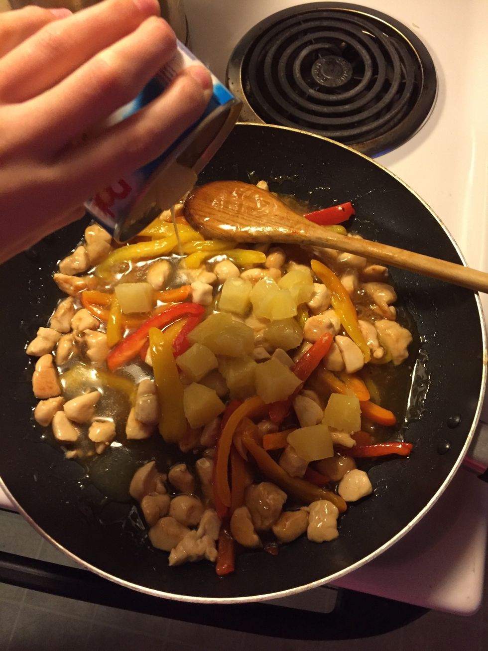 Add in your pineapple including the juice and stir.