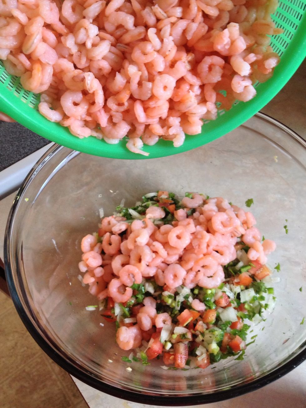 Add in your shrimp and your lemon juice.