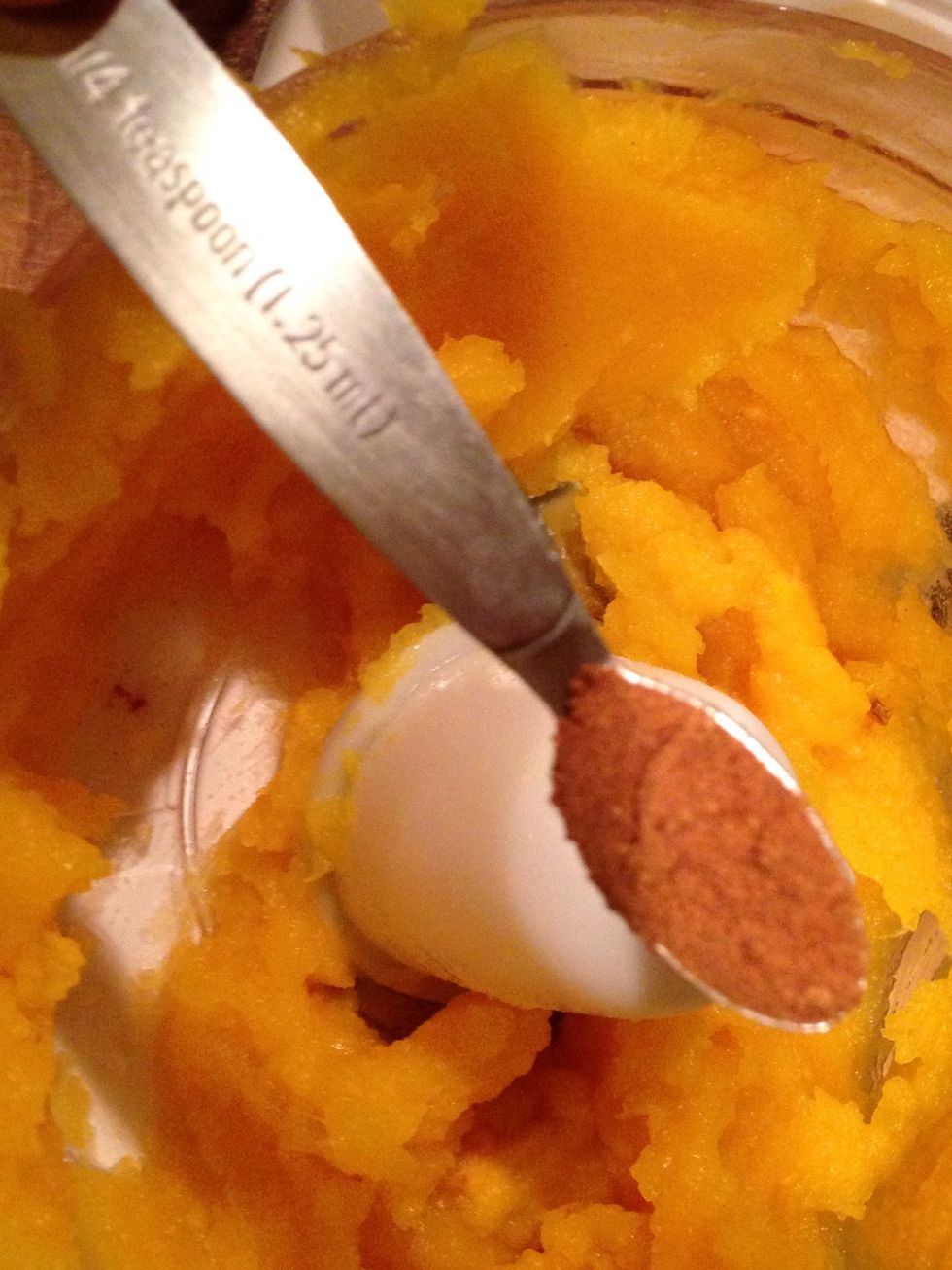 Add in your spices. Eyeball this here, as the sizes of the pumpkins will vary. I used half a tsp pumpkin spice & extra pinches of cardamom & nutmeg.