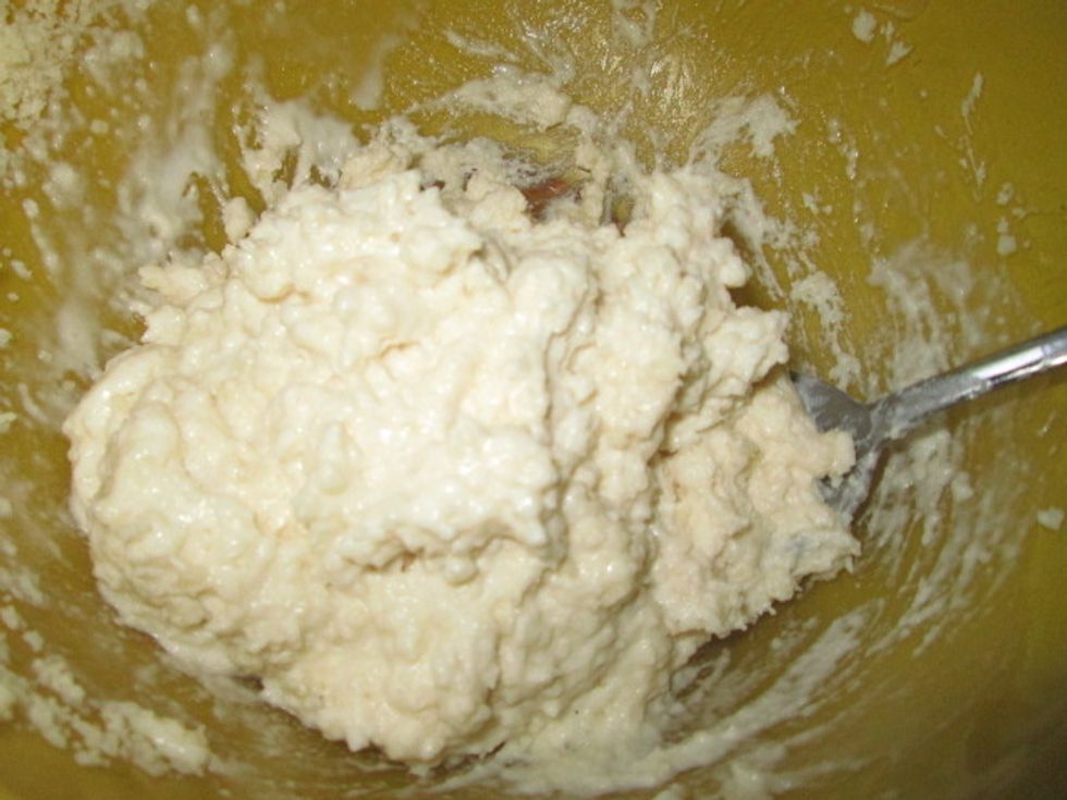 Add it all at once to the dry ingredients. It should look like dough. Add more milk if it is a little thick.