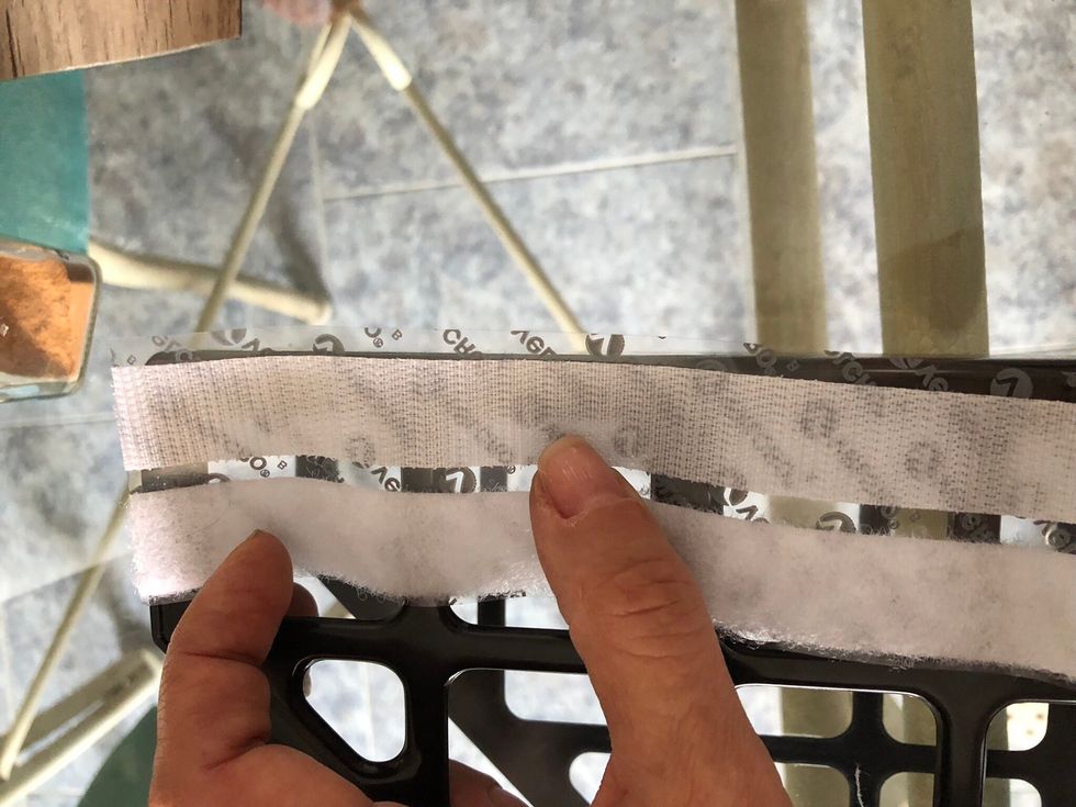 Add it by the sticky side to the holder