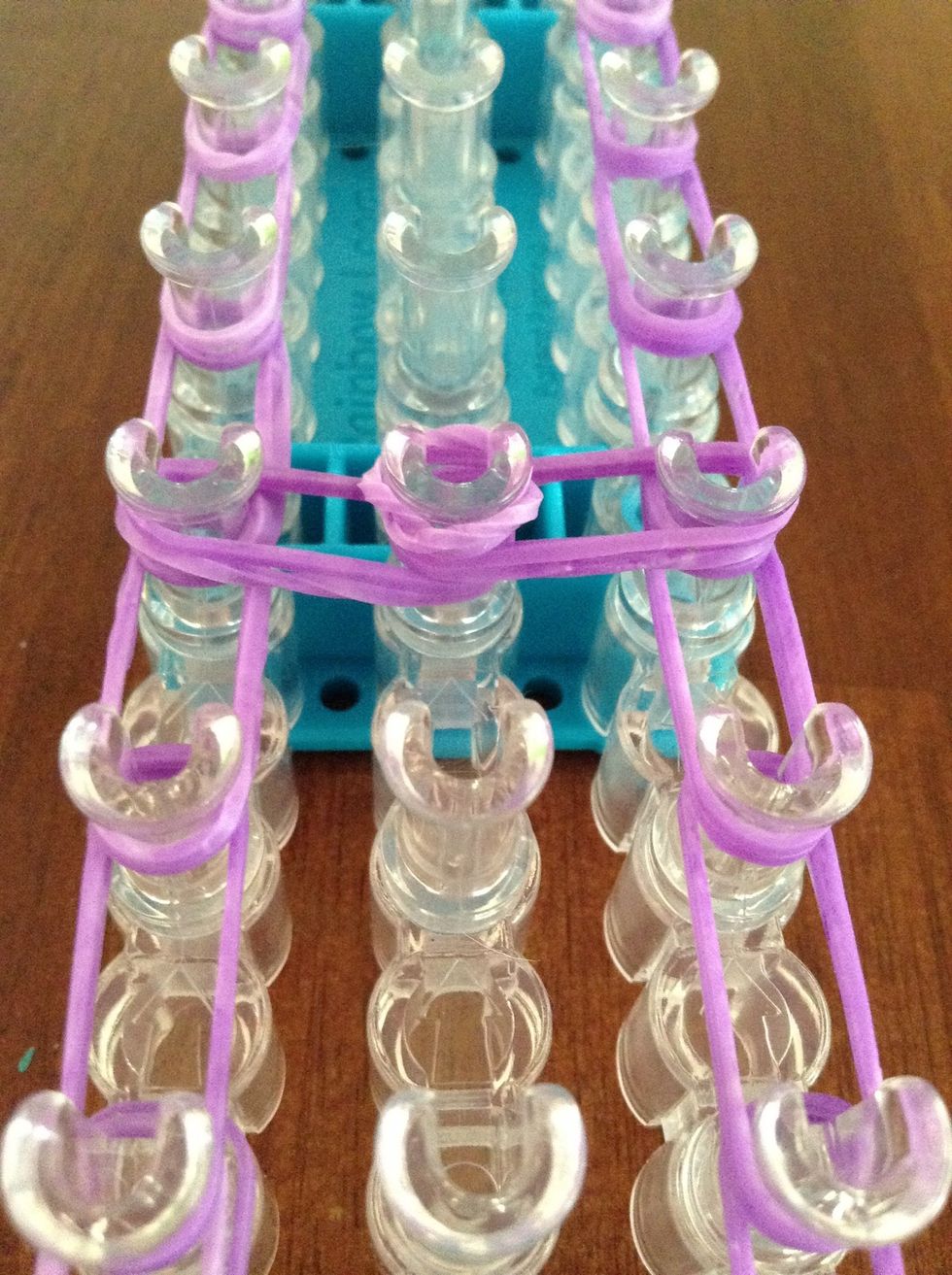 Add it to the center peg.