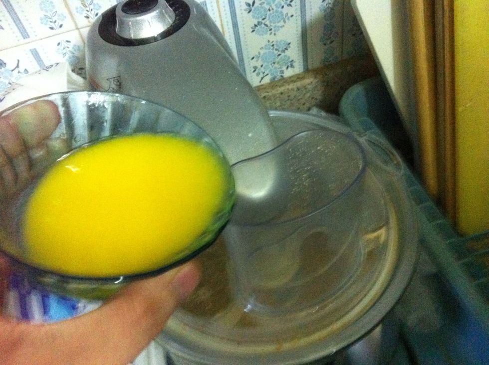 Add it to the crushed biscuits while the processor is running on low