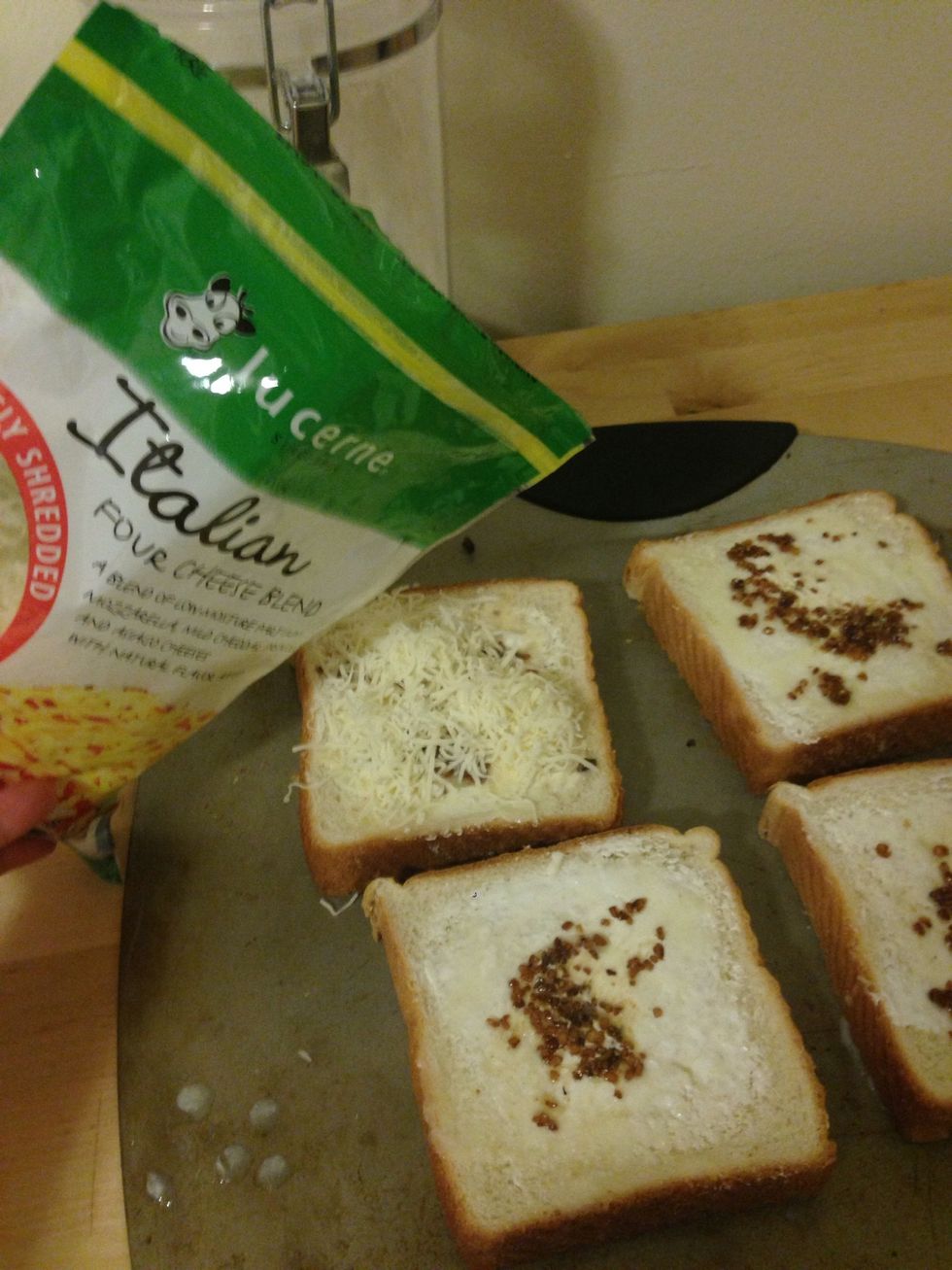 Add Italian cheese on top of each slice. I put around 1/8c on each one.
